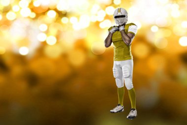 Futbolcu sarı üniforma ile