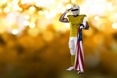 Futbolcu sarı üniforma ile