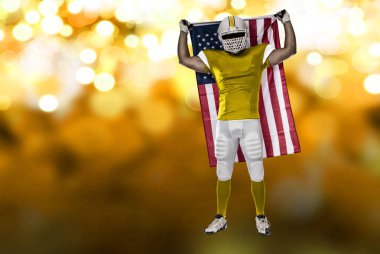 Futbolcu sarı üniforma ile