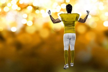 Futbolcu sarı üniforma ile