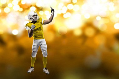 Futbolcu sarı üniforma ile