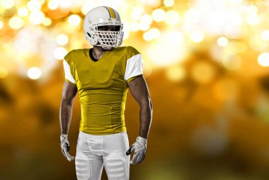 Futbolcu sarı üniforma ile