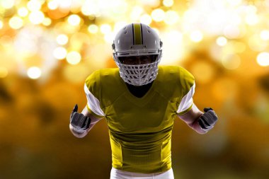 Futbolcu sarı üniforma ile