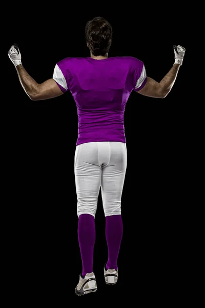 Fotbollsspelare med en rosa uniform — Stockfoto