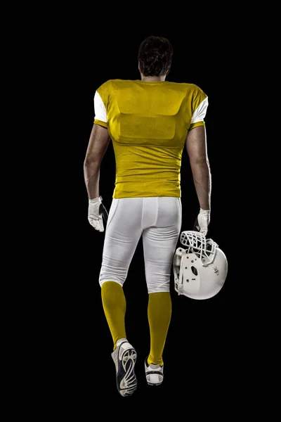 Fotbalista s žluté uniforma — Stock fotografie