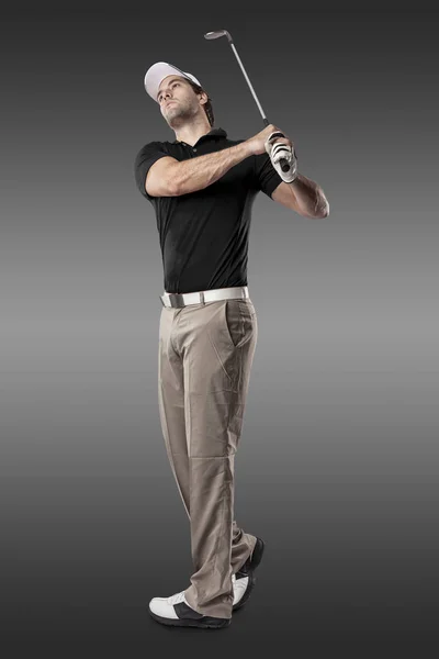 Gracz w golfa w czarnej koszulce — Zdjęcie stockowe
