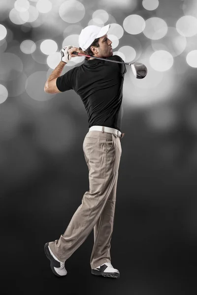 Golf-lejátszó egy fekete póló — Stock Fotó
