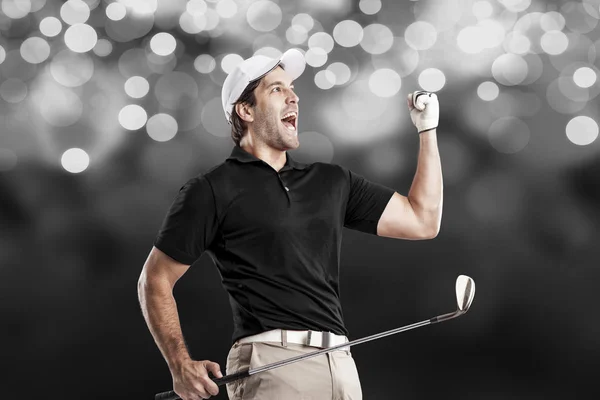 Gracz w golfa w czarnej koszulce — Zdjęcie stockowe