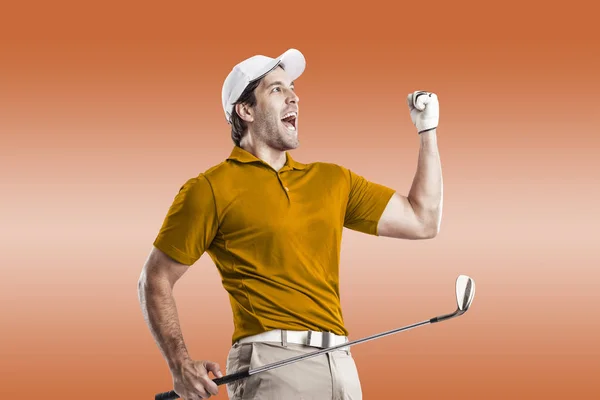 Golf Player in a orange shirt — Stock Photo, Image