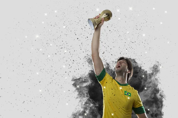 Brazilian soccer player coming out of a blast of smoke — Stock Photo, Image