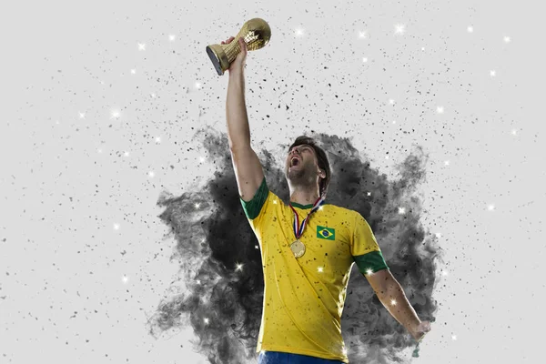 Brazilian soccer player coming out of a blast of smoke — Stock Photo, Image