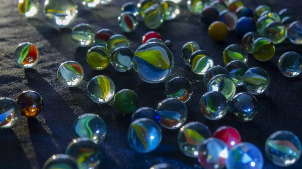 Marbles Scattered Rays Light Hitting Background — Stock Photo, Image