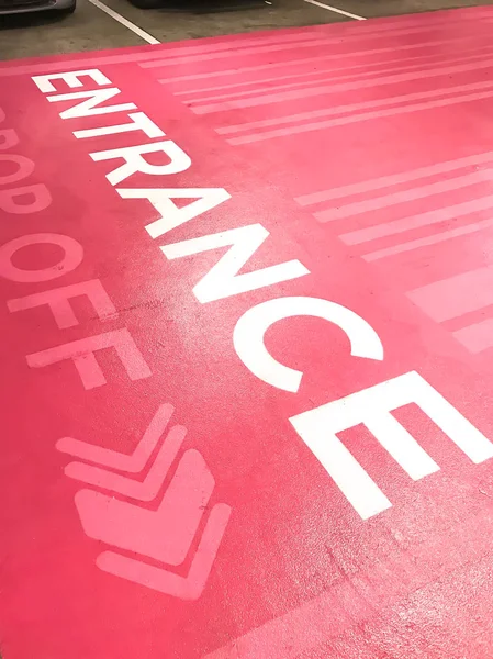 Entrance text on pink floor — Stock Photo, Image