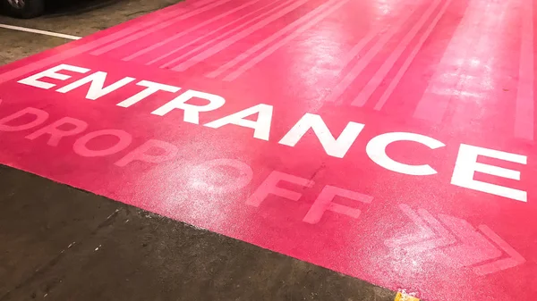 Entrance text on pink floor — Stock Photo, Image