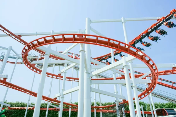 Funny with Roller Coaster in amusement park