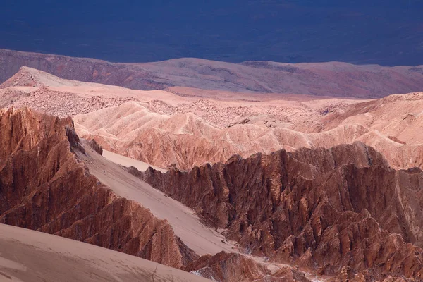 View of the landscape of the Atacama Desert. The rocks of the Mars Valley (Valle de Marte) and Cordillera de la Sal, Atacama Desert, Chile