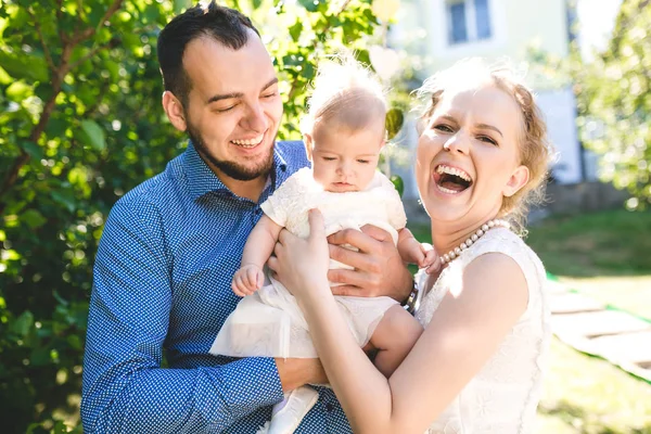 Happy joyful young family with child. Father, mother and little boy having fun — Stock Photo, Image