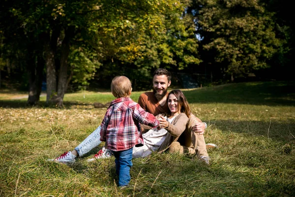 Young beautiful family with a child — Stock Photo, Image