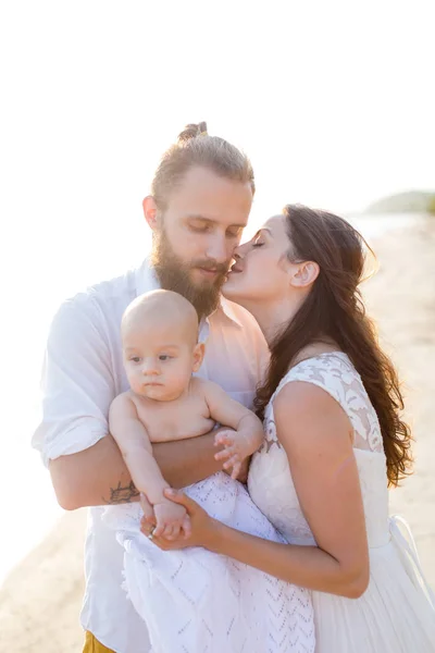 Young beautiful family with a child — Stock Photo, Image