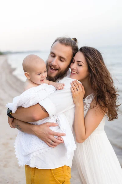 Young beautiful family with a child — Stock Photo, Image