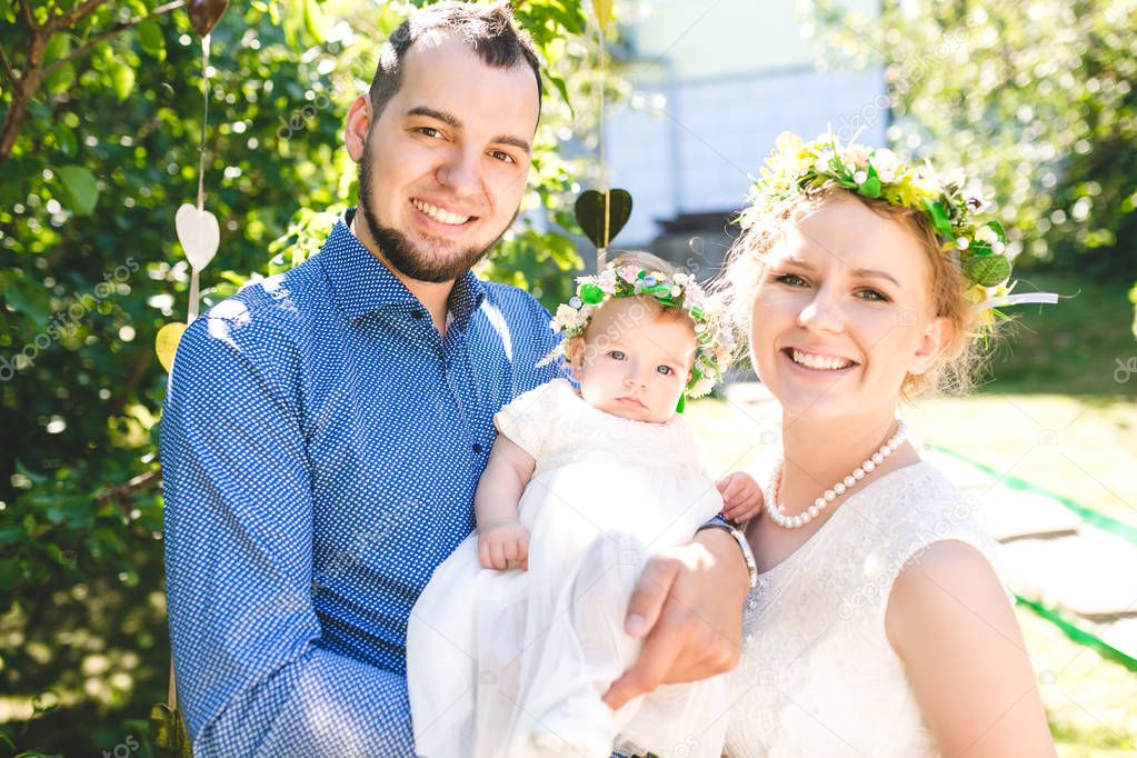 Happy joyful young family with child. Father, mother and little boy having fun