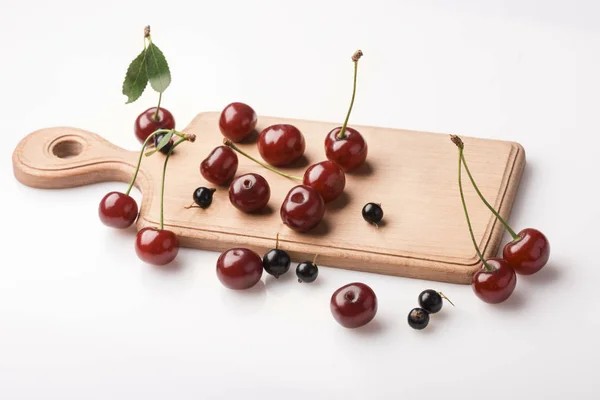 Still life board with berries.