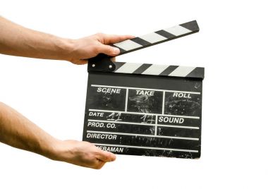 Beyaz arka plan üzerinde izole bir film Klaket ile el