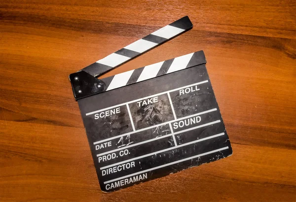 Movie clapper on the wood table — Stock Photo, Image