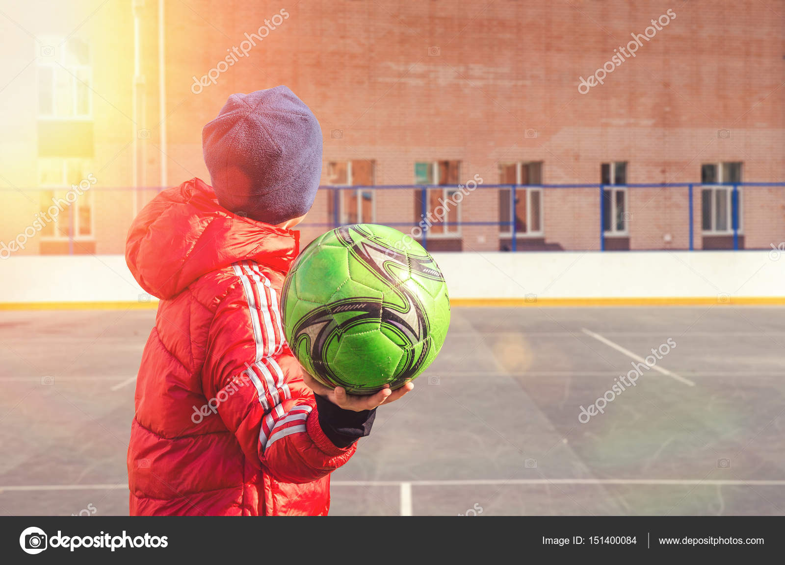 Boy throws a soccer ball Stock Photo by ©Saikorn 151400084