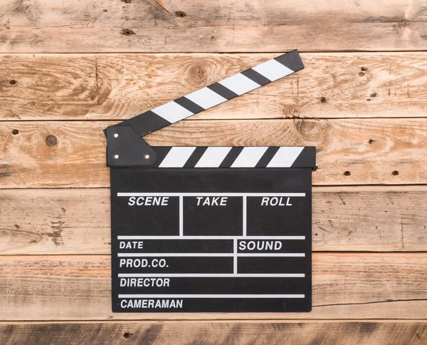 Clapperboard on wood background — Stock Photo, Image