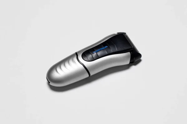 Modern battery Electric Shaver for man isolated on white background with clipping path.High-resolution photo.Top view.Close-up.
