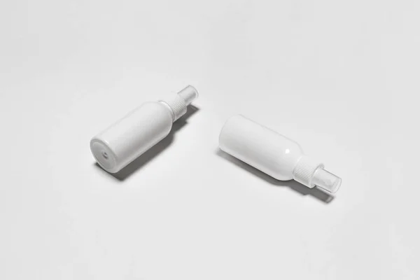Cosmetic Or Hygiene Spray Dispenser Pump Plastic Bottles on white background.Top view.High-resolution photo.