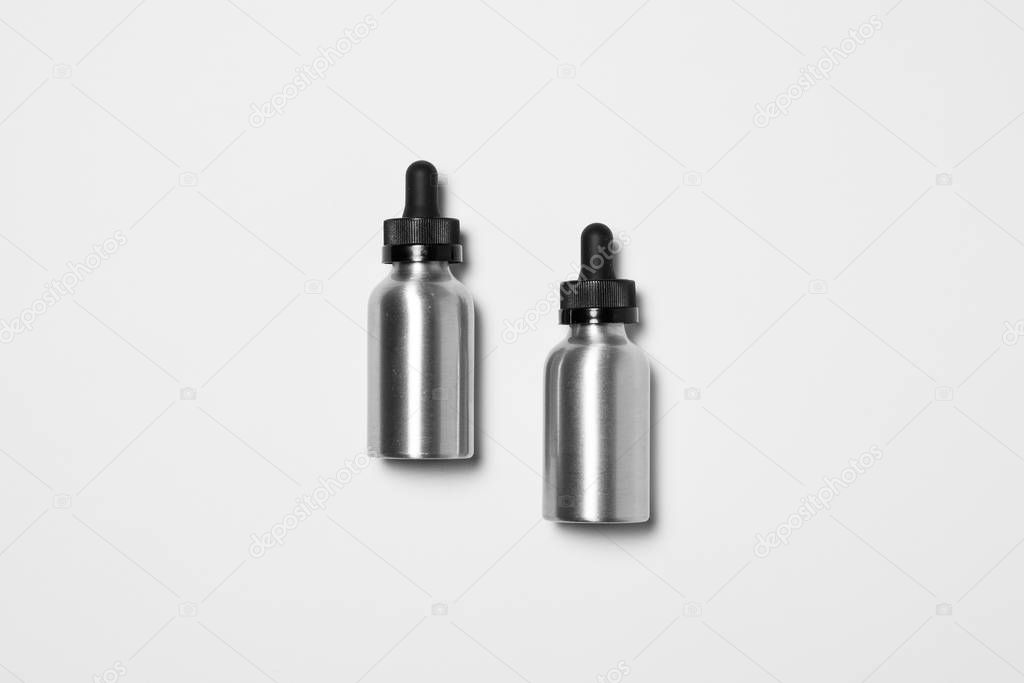 Blank Aluminum Bottle Dropper Cap on light gray background. Aluminum bottle Packaging Mockup set ready for your design. High-resolution photo.