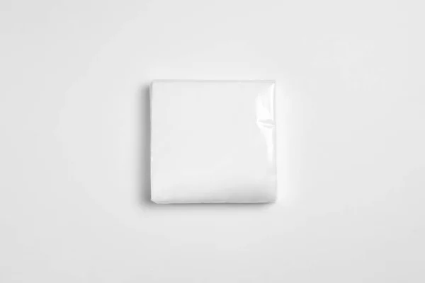 A Pack Of Pocket Paper Napkins Mock up on white. Disposable paper table napkins.High-resolution photo.