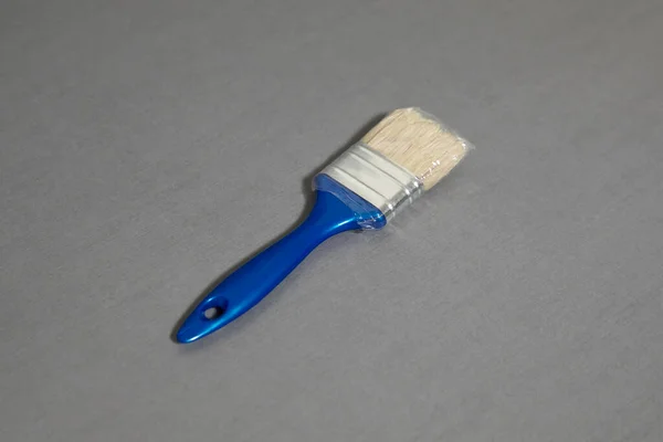 Paint Brush Mock-up isolated on gray background with clipping path. High-resolution photo.