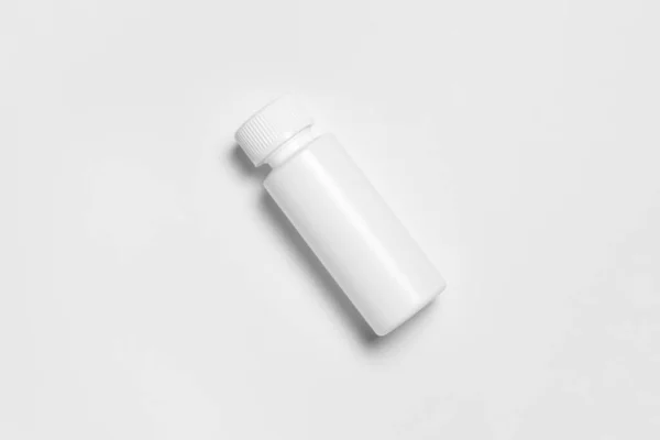 塑料瓶与一个长笛 装药的塑胶瓶 药局空白包装 医疗投料瓶 高分辨率照片 顶视图 — 图库照片