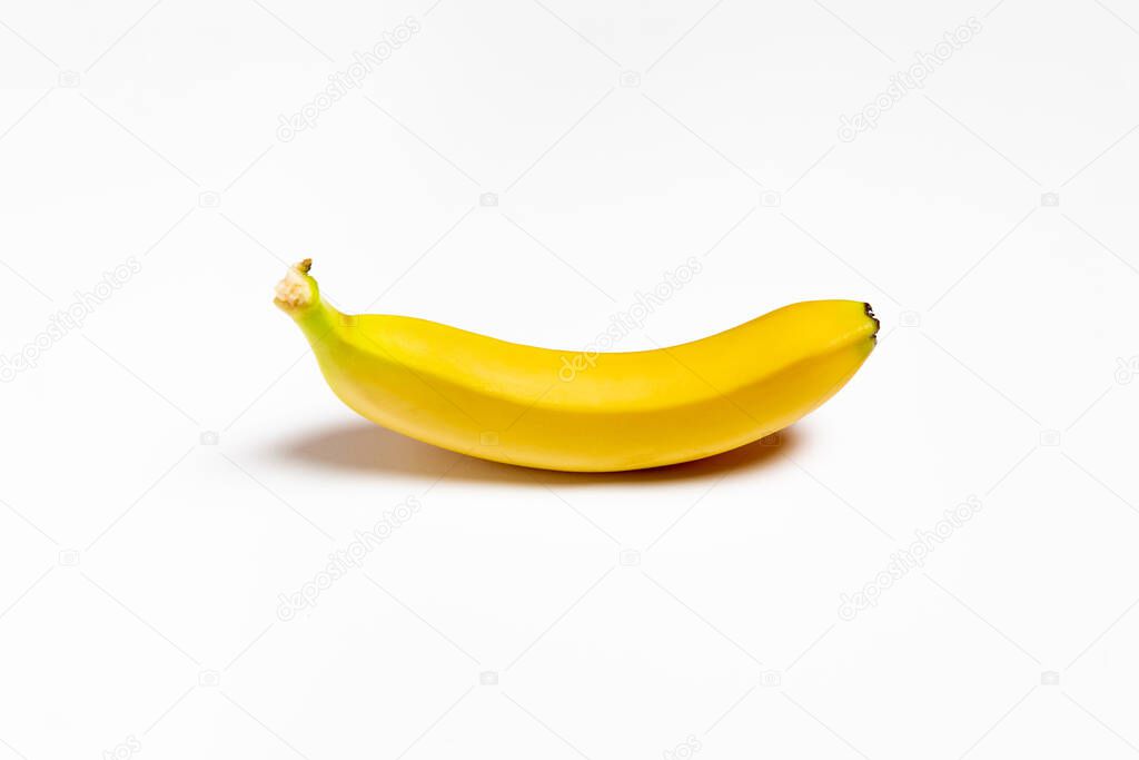 Single Banana isolated on white background. High-resolution photo.