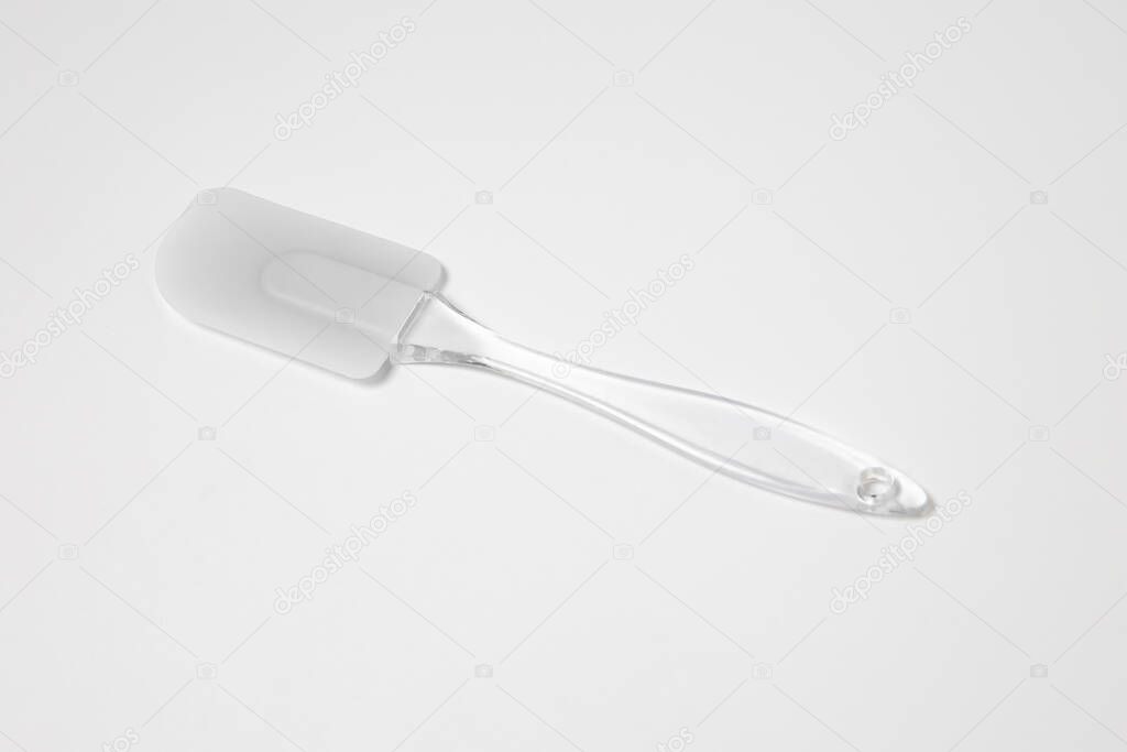 Kitchen silicone spatula on white background.Top view. High-resolution photo.