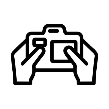 Kamera ikon vektörünün elinde. İzole edilmiş kontür sembolü gösterimi