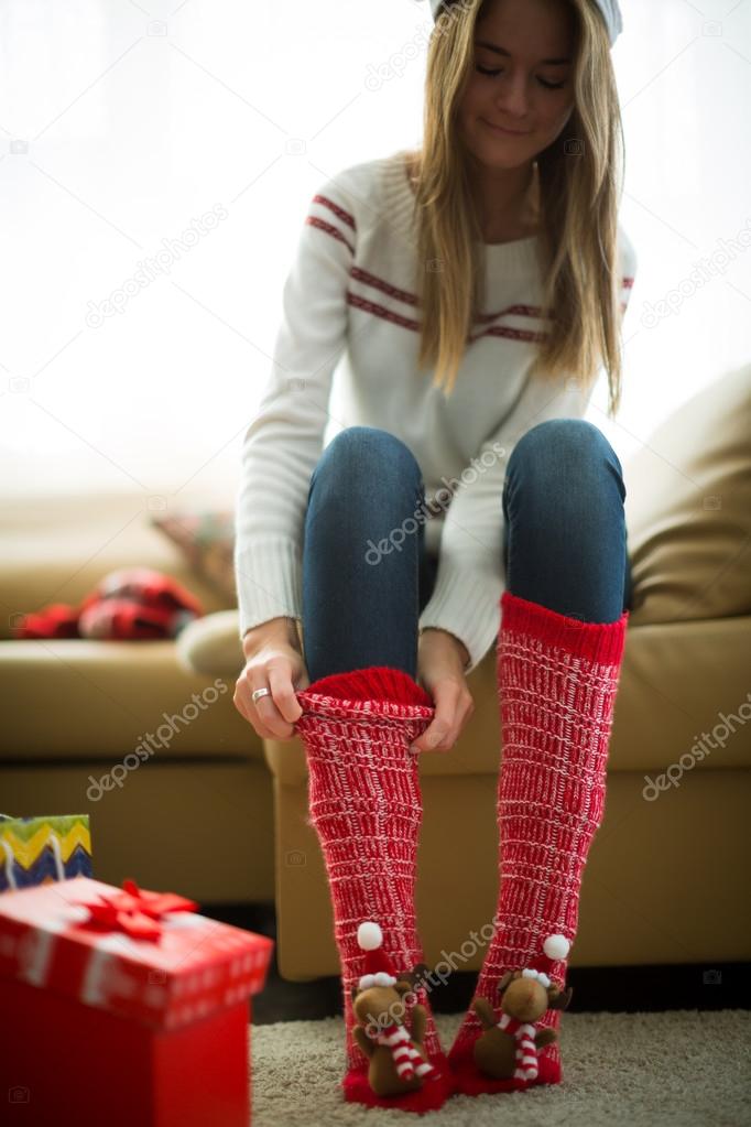 Girl wearing red christmas socks 