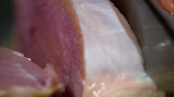 Cook slices the raw turkey meat — Stock Video