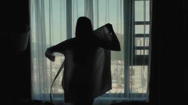 Woman Dresses Peignoir By The Window — Stock Video