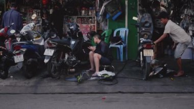 Outdoor motorcycle repair shop