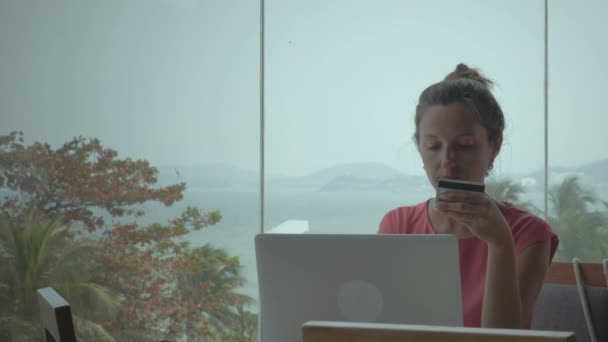 Girl Making Online Purchases In Hall With Big Windows — Αρχείο Βίντεο