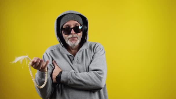 Senior Cool Man Against A Yellow Wall — Αρχείο Βίντεο