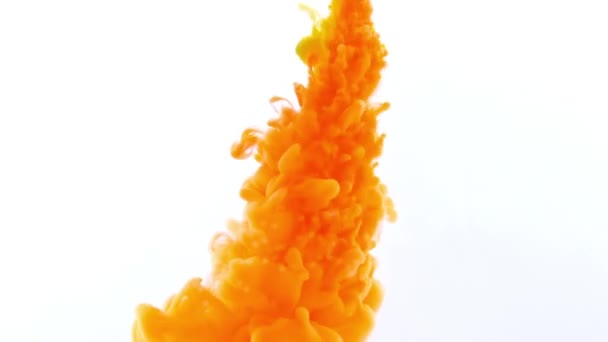 Drop of orange Ink color paint falling on water — Stock Video