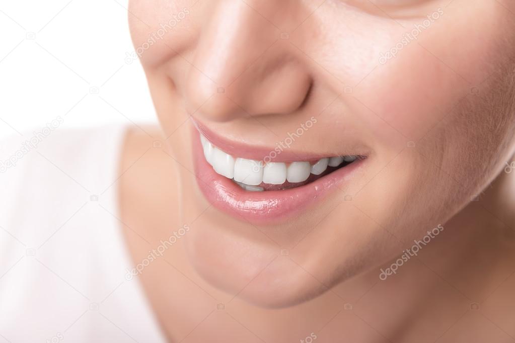 Beautiful wide smile of young woman.