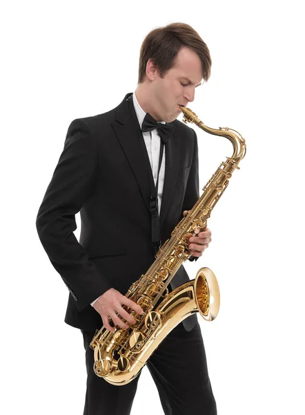 Saxophonist in a tuxedo plays music on sax. — Stock Photo, Image