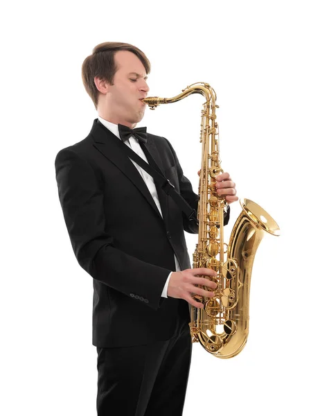 Saxophonist in a tuxedo plays music on sax. — Stock Photo, Image