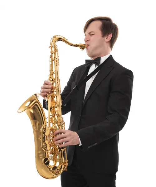 Saxophonist in a tuxedo plays music on sax. — Stock Photo, Image